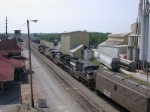 SB freight enters the yard past the depot and tower